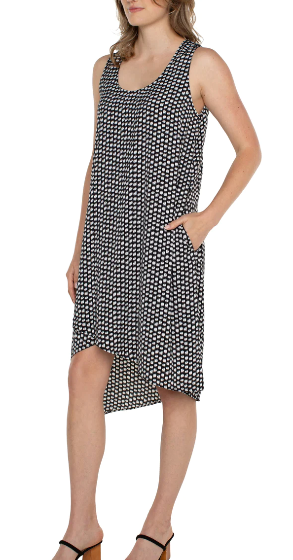 SLEEVELESS DRESS WITH ASYMMETRIC HEM